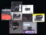 8 VARIOUS BOXED RED DOT SIGHTS.