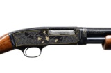 NEIL HARTLIEP ENGRAVED WINCHESTER 42 PUMP SHOTGUN.