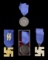 4 WWII STYLE GERMAN SS LONG SERVICE MEDALS.
