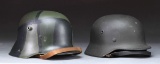 2 GERMAN MILITARY HELMETS.