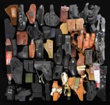 LARGE LOT OF ASSORTED FIREARMS HOLSTERS &