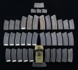 LOT OF RUGER MINI-14 MAGAZINES & STOCKS.