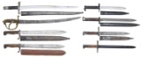 VARIED GROUPING OF SEVEN BAYONETS AND ONE SWORD.