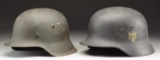 2 WWII GERMAN HELMETS.