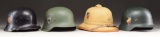 4 WWII GERMAN HELMETS.