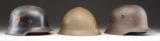 1 WWI & 2 WWII AXIS HELMETS.