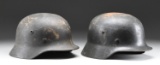 2 WWII GERMAN HELMETS.