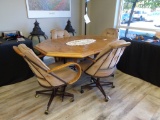 Wood dining table and 4 rolling fabric chairs