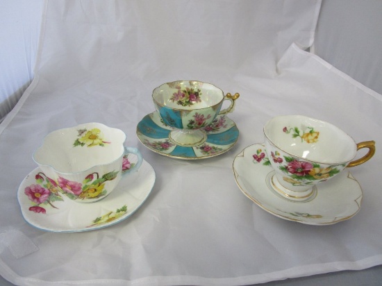 3 bone china cups and saucers.