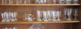 Lot of 23 glass items middle shelf of hutch