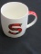 New S Monogram Mug in a Red Plaid Tin