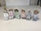 Lot of 7 Porcelain Dolls with stands 8 inches