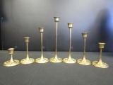 Set of seven brass candlesticks