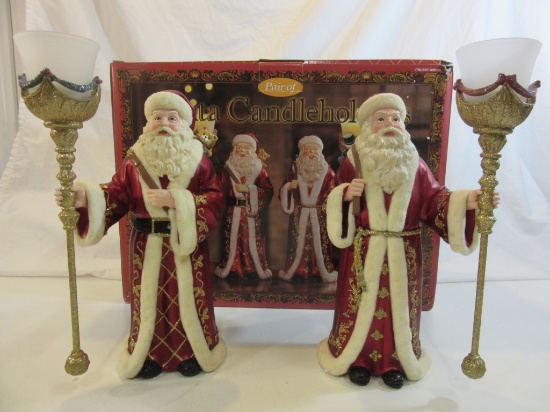 Set of Candle Holding Santa Clauses