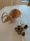 Three sets of napkin rings in wine bottle basket