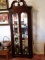 Lighted wood curio cabinet with mirrors
