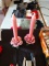 Two pink floral candle sticks with candles