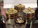 4 gold-tone trinket boxes