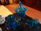 3 blue glass items candy dish vase and bowl