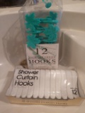 Two sets of shower curtain hooks