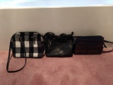3 black purses one with white and black plaid