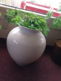 Large ceramic planter pot with artificial plants