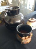 Rustic pots and a ceramic pitcher
