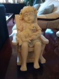 Little girl with cat in rocking chair figurine