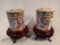 Pair of decorative Oriental jars on wood stands