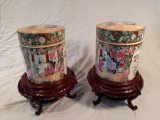 Pair of decorative Oriental jars on wood stands