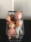 Miniature shopping basket with five baby dolls