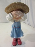 Ceramic Figurine of a Girl Playing Hide and Seek