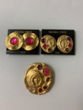 Lot of two vintage costume jewelry clip on earrings with a matching broach