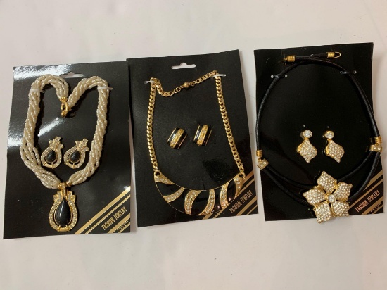 Lot of three costume vintage necklace and earring sets.