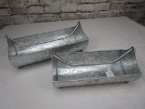 Two decorative metal planters with handles