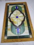 Vintage stained glass pane in wood frame