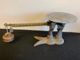 vintage cast iron table top scale with weights