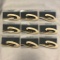 Lot of 9 Identical Gold-Toned and White Brooches