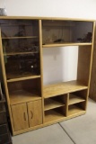 Oak Entertainment Center with glass frontage cabinets