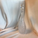 Tall cut glass decanter with stopper