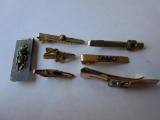 Lot of 6 gold and silver-tone men's tie clips and a money clip
