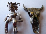 Silver-plated Aztec-themed male warrior brooch/pendant and pewter bull's skull marked S. Klein