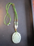 Jade pendant with fabric threaded necklace and jade beads