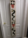 Native American-style had-beaded wall hanging with serpents and masks. 65