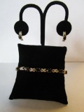 Set of costume jewelry pierced earrings and a tennis bracelet with black and clear stones