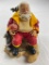 Musical plastic Santa Fireman figure holding fireman helmet