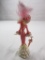 Ceramic fancy lady figurine with a parasol; breast cancer commemorative by Thomas Kinkade......