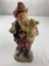 Glitter plastic Santa Fireman figure holding a child