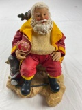Musical plastic Santa Fireman figure holding fireman helmet