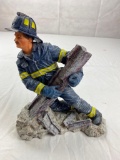 Fireman figure holding up a I-Beam plastic material